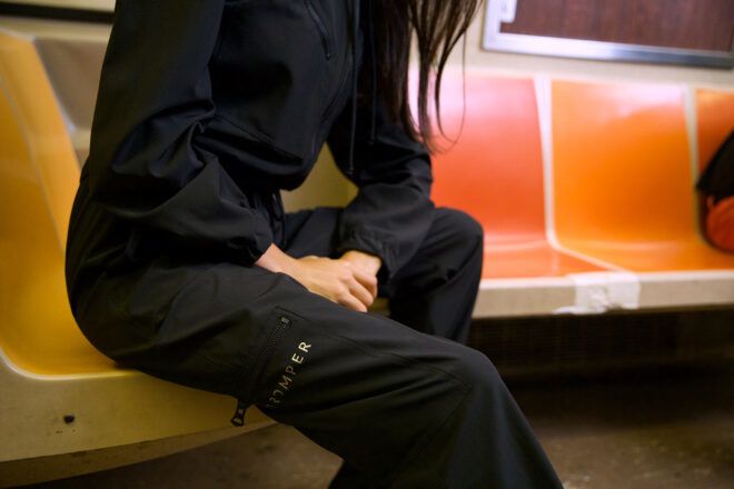person sitting on subway while wearing BioRomper