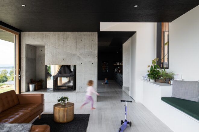 kid running through gray living room