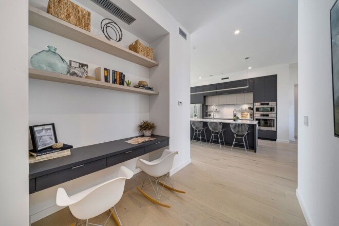 black built-in desk near a kitchen
