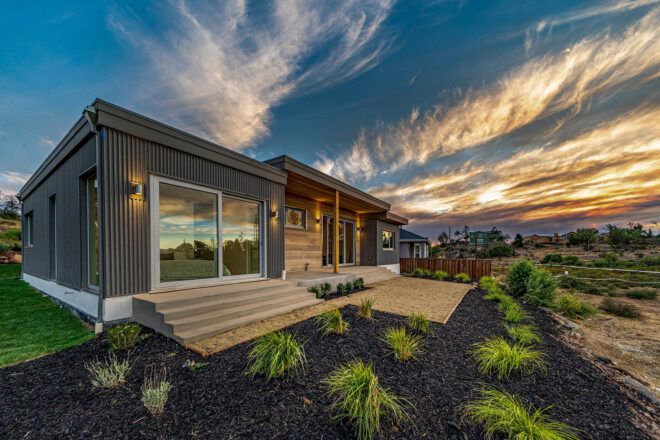 gray home with wood accents at sunset