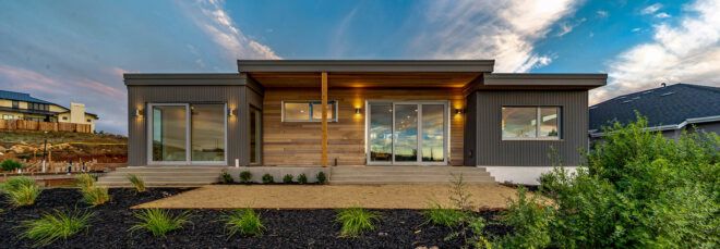 wood and gray home at sunset