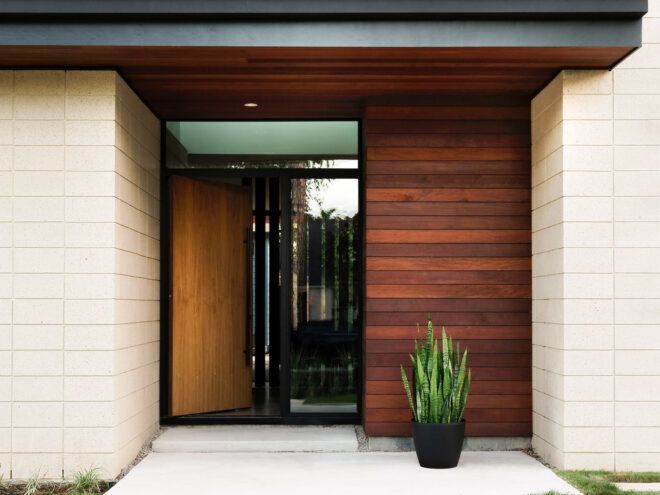 entrance to wood and brick home