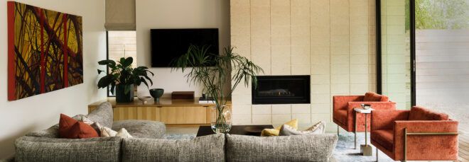 living room with gray sofa and dark orange chairs