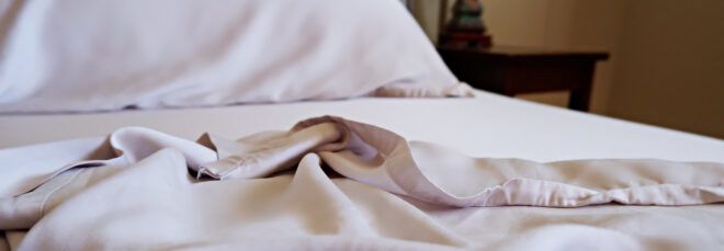 gray bamboo sheets on a bed