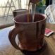 pouring instant coffee into a mug