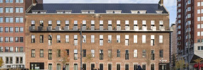 old brick building with several rows of windows
