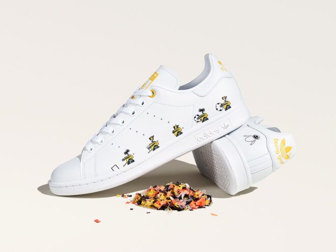 pile of shredded plastic next to adidas sneakers