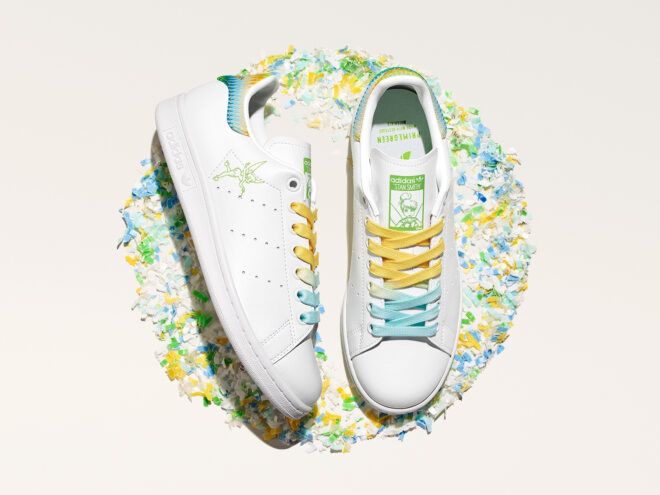 pile of shredded plastic around adidas sneakers with Tinkerbell design