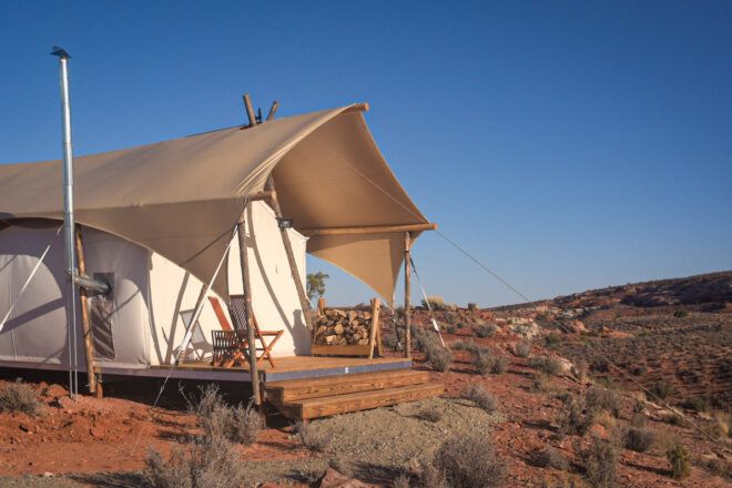canvas tent in desert landscape