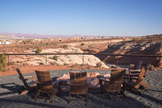 chairs around a firepit with desert views