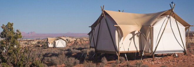 canvas tent in desert landscape
