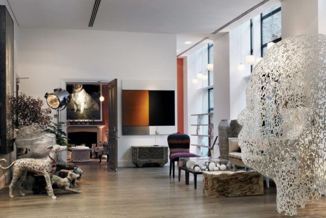 A hotel room decorated with modern artwork and sculptures.