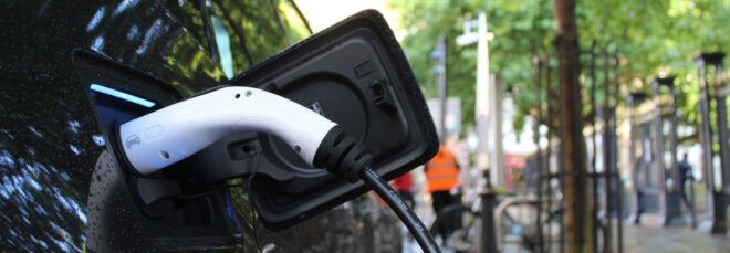 charger plugged into electric car