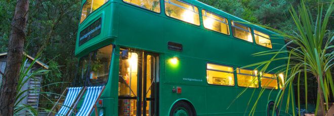 A sideview of the green bus.