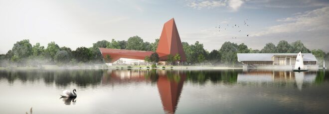 Two red, angular volumes making up a building by a serene lake.