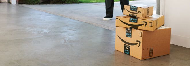 cardboard Amazon boxes stacked up in a garage