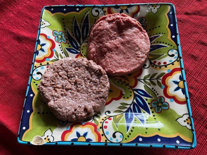 brown Beyond and pink Impossible burgers on a plate