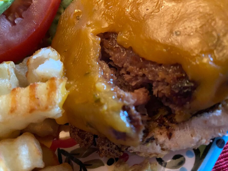 close-up of pink interior of plant-based burger