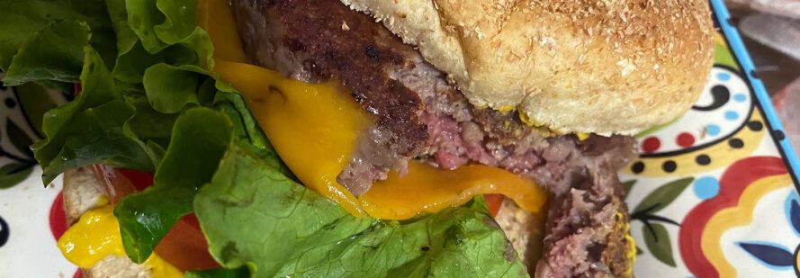 close-up of juicy pink interior of vegan burger