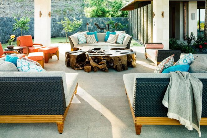 living area with white furniture and wood table