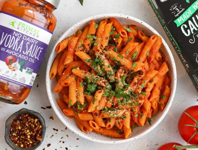 pasta near jar of tomato sauce