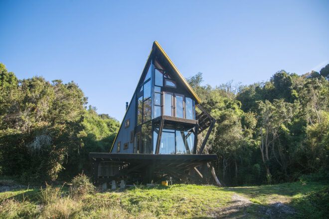 cabin on stilts with angled roof