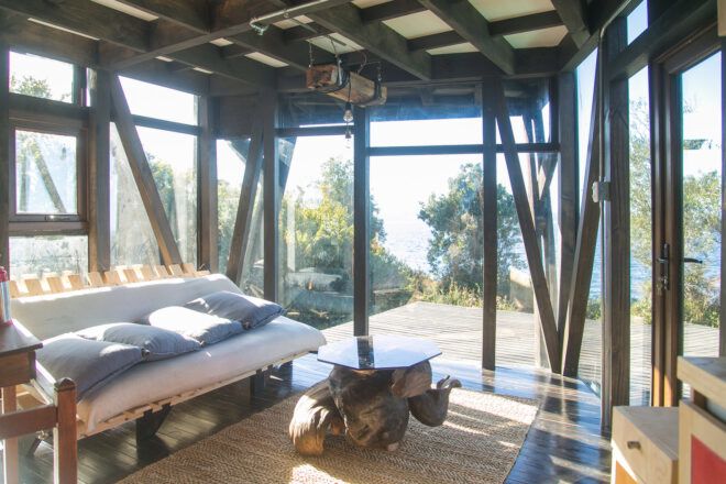 bed against wall of glass