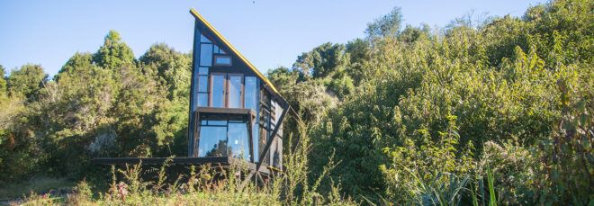 cabin on stilts with angled roof