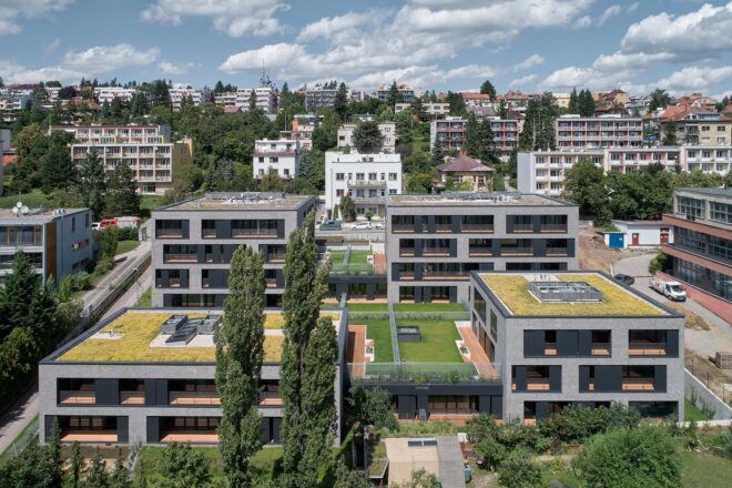 aerial view of gray buildings with green roofs