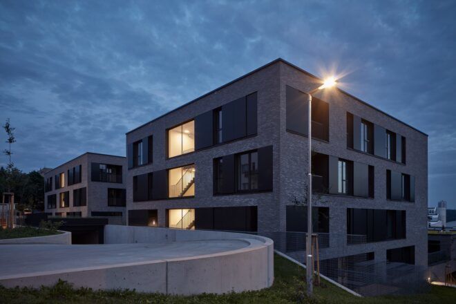 gray pre-war-style architectural building at dusk
