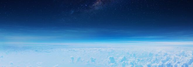 starry sky above cloudy layer of Earth's atmosphere
