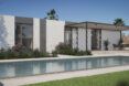 gray home with pergola and large rectangular pool
