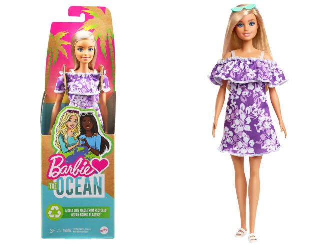 Doll in purple dress and cardboard packaging