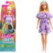 Doll in purple dress and cardboard packaging