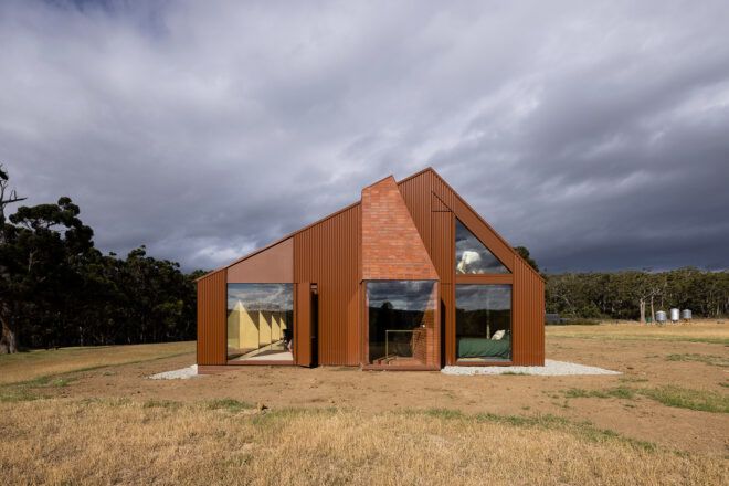 dark red home with brick