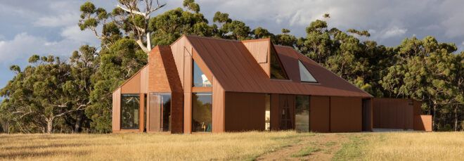 dark red home with brick