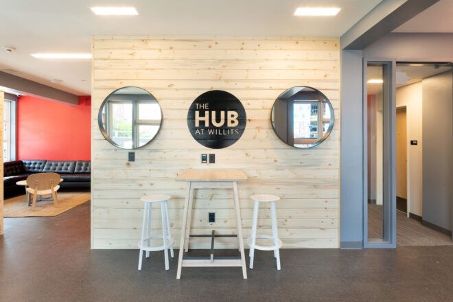 wood wall with graphic that reads "Hub at Willits"