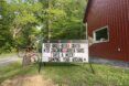 A sign in front of Arrowhead Bike Farm reading 