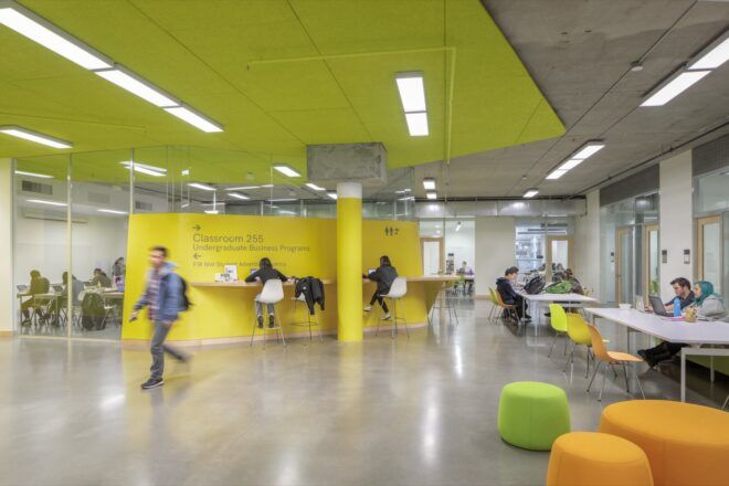 bright yellow room with orange and green seats
