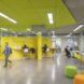 bright yellow room with orange and green seats