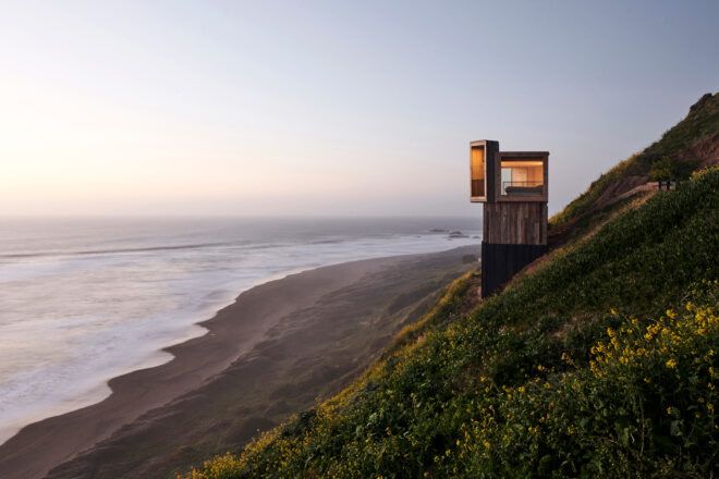 light and dark wood cabin overlooking the ocean