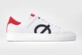 blue, red and white vegan sneaker on white background