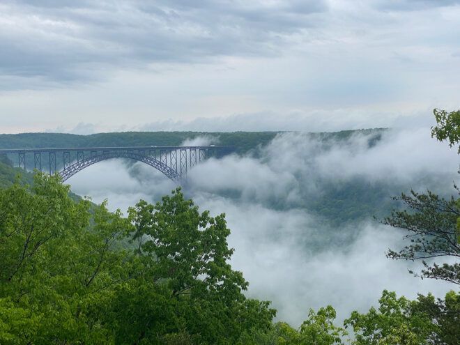 misty mountains and bridge