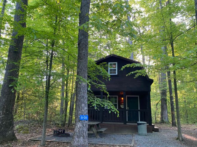 black cabin in the woods
