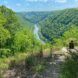 person sitting on rock overlooking New River Gorge