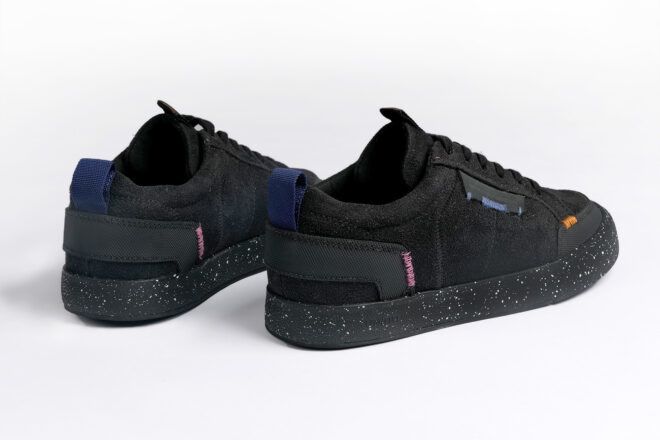 black vegan sneakers on white background