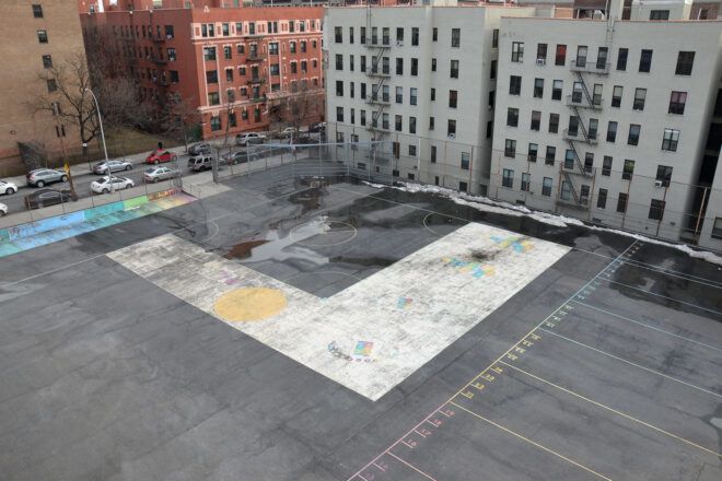before gray parking lot in NYC