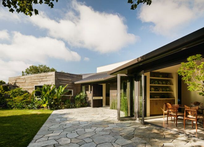 home with doors open to patio and yard