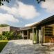 home with doors open to patio and yard