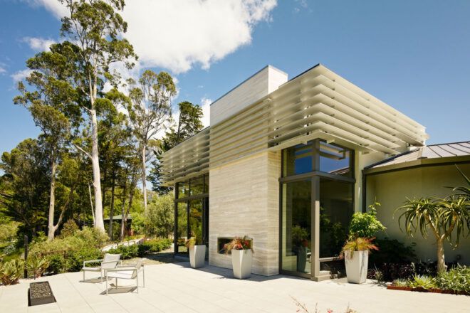tan and white house with white patio